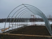 It is important to remember that when the structure is being pulled from a single point, it will want to collapse. Therefore it is necessary to have something solid across at the front. This will be just high enough to clear crops. The rest of the structure will want to spread so it also must be secured but with cables.